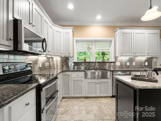 1010 Arabian Farm Rd, Clover, SC 29710 - kitchen featuring appliances with stainless steel finishes, a sink, crown molding, decorative backsplash, and dark stone countertops