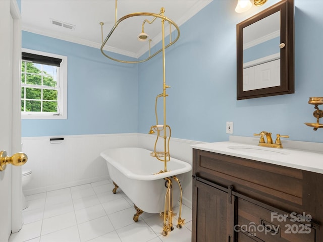 1010 Arabian Farm Rd, Clover, SC 29710 - bathroom featuring a wainscoted wall, ornamental molding, a freestanding bath, vanity, and toilet