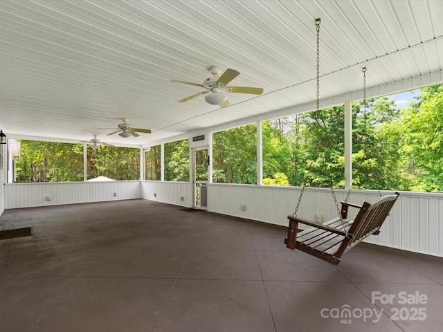 1010 Arabian Farm Rd, Clover, SC 29710 - unfurnished sunroom with ceiling fan and view of scattered trees
