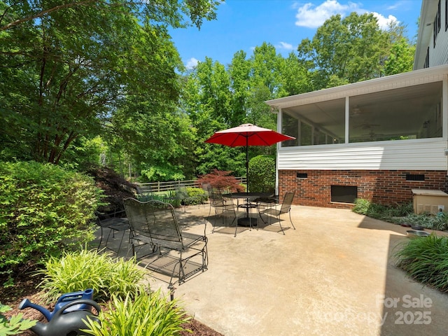1010 Arabian Farm Rd, Clover, SC 29710 - view of patio with outdoor dining space, a sunroom, and view of wooded area