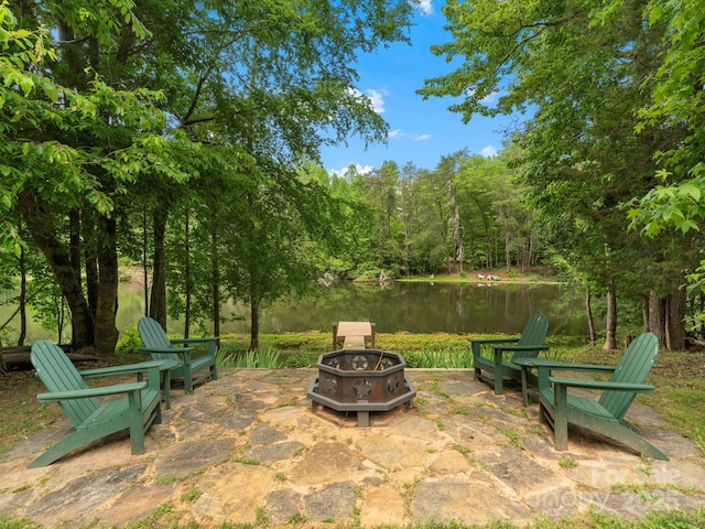 1010 Arabian Farm Rd, Clover, SC 29710 - view of patio / terrace featuring a fire pit, a water view, and a view of trees