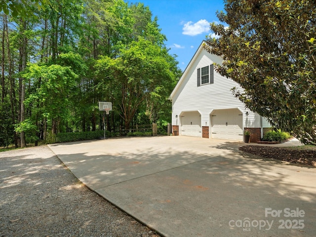 1010 Arabian Farm Rd, Clover, SC 29710 - view of property exterior with concrete driveway, a garage, and brick siding