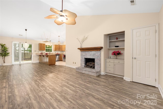 172 Valleybrook Dr Unit 8, Denver, NC 28037 - unfurnished living room featuring lofted ceiling, ceiling fan, wood finished floors, and a fireplace