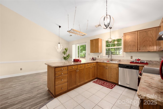 172 Valleybrook Dr Unit 8, Denver, NC 28037 - kitchen featuring stainless steel dishwasher, a peninsula, decorative light fixtures, brown cabinetry, and lofted ceiling