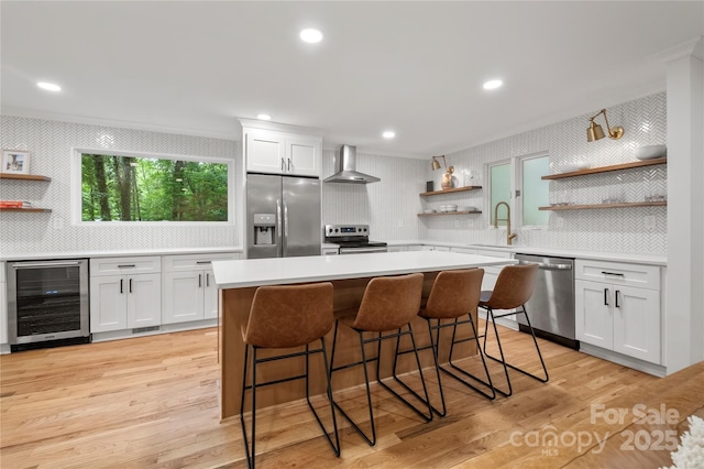 5016 Celeste Ct, Charlotte, NC 28270 - kitchen with open shelves, beverage cooler, appliances with stainless steel finishes, wall chimney exhaust hood, and a sink