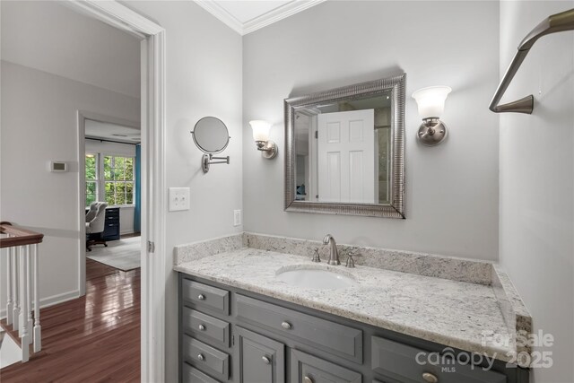 5016 Celeste Ct, Charlotte, NC 28270 - bathroom featuring ornamental molding, wood finished floors, vanity, and baseboards
