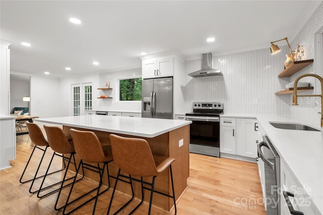 5016 Celeste Ct, Charlotte, NC 28270 - kitchen with stainless steel appliances, open shelves, wall chimney exhaust hood, a sink, and a center island
