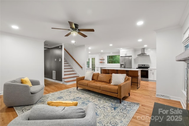 5016 Celeste Ct, Charlotte, NC 28270 - living area featuring ceiling fan, stairway, light wood finished floors, recessed lighting, and a fireplace