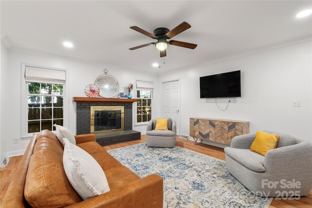 5016 Celeste Ct, Charlotte, NC 28270 - living room featuring healthy amount of natural light, ceiling fan, ornamental molding, a brick fireplace, and recessed lighting
