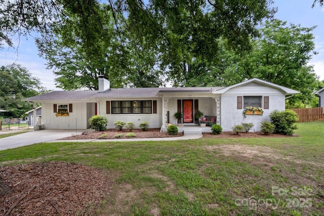 1109 S Highland Ave, Landis, NC 28088 - single story home with a chimney, concrete driveway, board and batten siding, covered porch, and brick siding