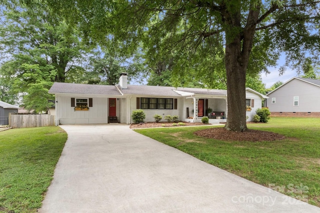 1109 S Highland Ave, Landis, NC 28088 - ranch-style house featuring concrete driveway and a chimney