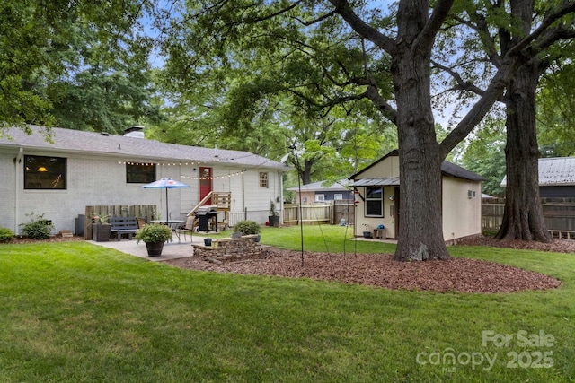 1109 S Highland Ave, Landis, NC 28088 - rear view of property with a patio area, a chimney, and brick siding