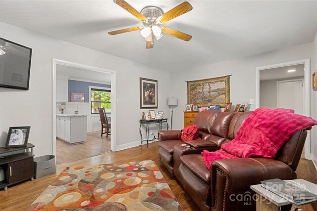 1109 S Highland Ave, Landis, NC 28088 - living room with light wood-type flooring, a ceiling fan, and baseboards