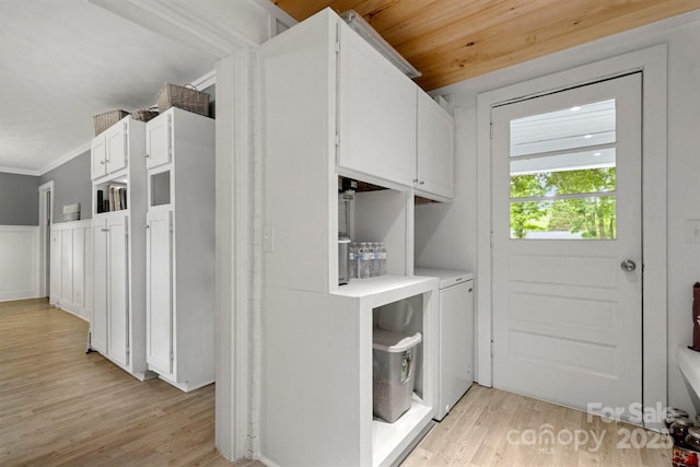 1109 S Highland Ave, Landis, NC 28088 - washroom featuring light wood-type flooring, washing machine and clothes dryer, and ornamental molding