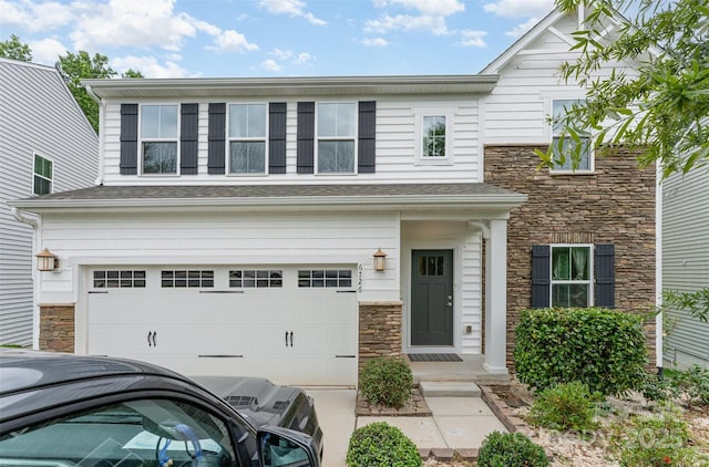 6726 Carradale Way, Charlotte, NC 28278 - view of front of home with stone siding, an attached garage, and concrete driveway