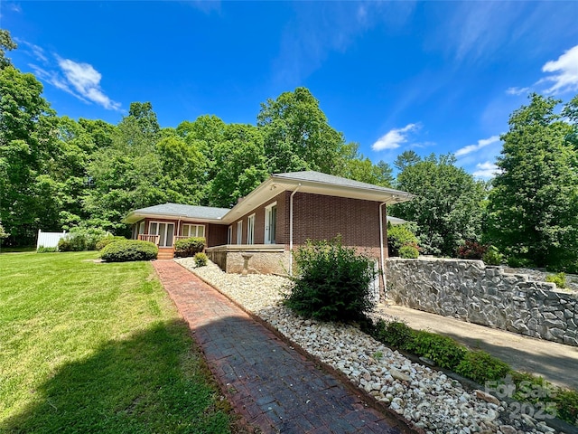 2866 Old Morganton Rd, Lenoir, NC 28645 - view of side of property with a lawn and brick siding