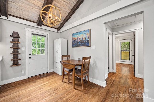 605 Cobb St, Lowell, NC 28098 - dining room featuring a chandelier, healthy amount of natural light, wood ceiling, light wood-type flooring, and baseboards