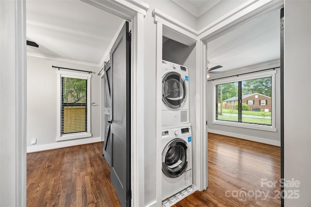 605 Cobb St, Lowell, NC 28098 - laundry area featuring stacked washer and clothes dryer, healthy amount of natural light, dark wood-style floors, a ceiling fan, and crown molding