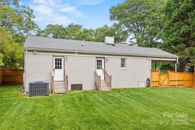 605 Cobb St, Lowell, NC 28098 - back of house with entry steps, central AC, brick siding, a chimney, and a gate