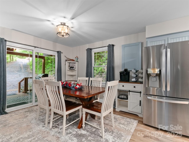 306 Mashstomp Rd, Maggie Valley, NC 28751 - dining area with light wood-type flooring and a chandelier