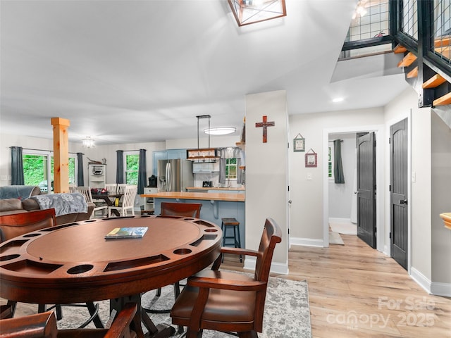 306 Mashstomp Rd, Maggie Valley, NC 28751 - dining area featuring light wood-type flooring and baseboards