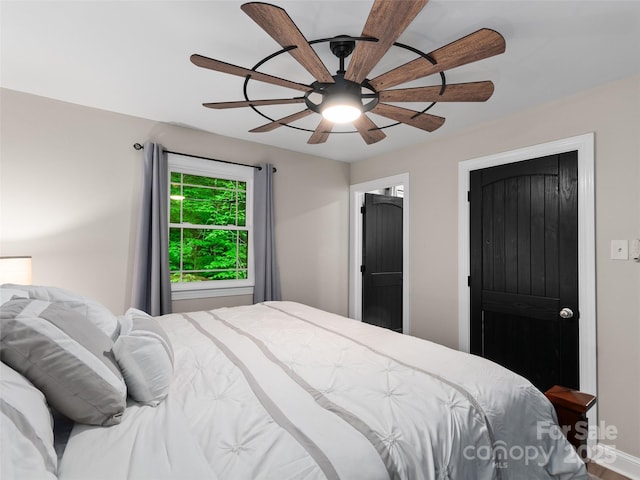 306 Mashstomp Rd, Maggie Valley, NC 28751 - bedroom with ceiling fan and baseboards