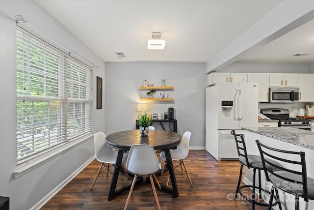 1410 Swaying Branch Ln, Clover, SC 29710 - dining room with plenty of natural light, dark wood-style flooring, and baseboards