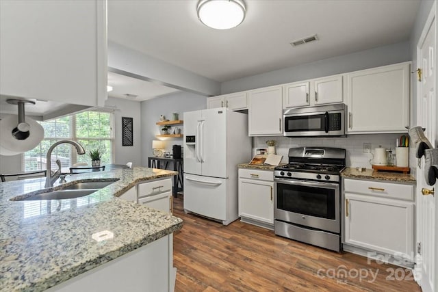 1410 Swaying Branch Ln, Clover, SC 29710 - kitchen featuring appliances with stainless steel finishes, a sink, white cabinets, and decorative backsplash