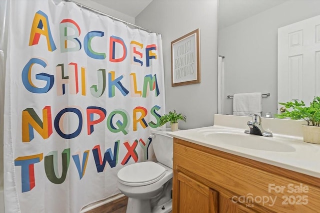 1410 Swaying Branch Ln, Clover, SC 29710 - full bathroom with vanity, toilet, curtained shower, and wood finished floors