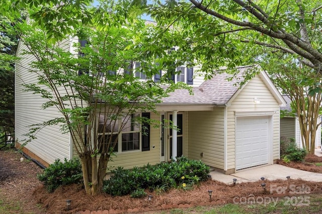 1410 Swaying Branch Ln, Clover, SC 29710 - view of front of home with a shingled roof, an attached garage, and driveway