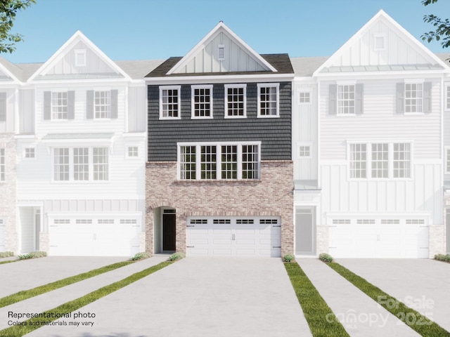 1041 Bandon Dr, Waxhaw, NC 28173 - townhome / multi-family property with board and batten siding, concrete driveway, and stone siding