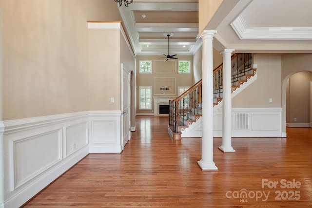 100 Woodwinds Dr, Mount Holly, NC 28120 - entrance foyer with ornamental molding, a decorative wall, ceiling fan, arched walkways, and stairs