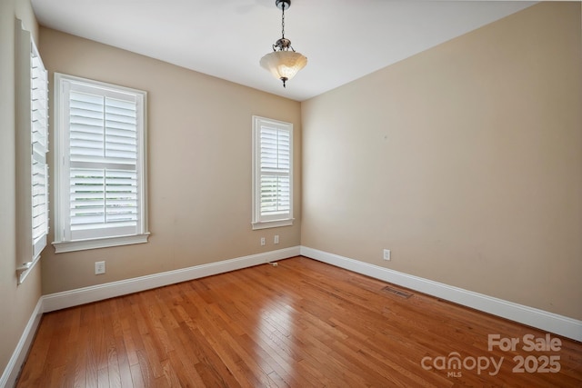 100 Woodwinds Dr, Mount Holly, NC 28120 - empty room with light wood finished floors and baseboards