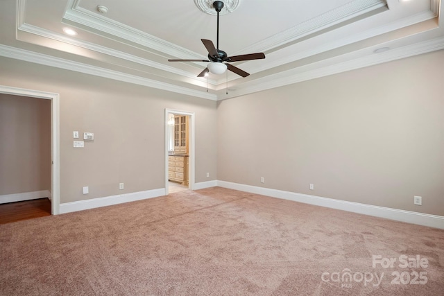 100 Woodwinds Dr, Mount Holly, NC 28120 - unfurnished room featuring a tray ceiling, light carpet, ceiling fan, ornamental molding, and baseboards