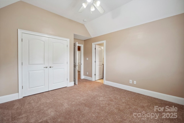 100 Woodwinds Dr, Mount Holly, NC 28120 - unfurnished bedroom featuring light carpet, lofted ceiling, baseboards, a closet, and a ceiling fan
