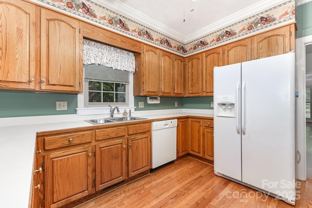 1750 Trellis Dr, Rock Hill, SC 29732 - kitchen with white appliances, a sink, light wood-style flooring, light countertops, and brown cabinetry