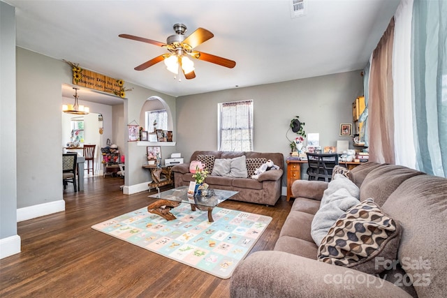 2217 Tate St, Charlotte, NC 28216 - living room featuring wood finished floors, a ceiling fan, and baseboards