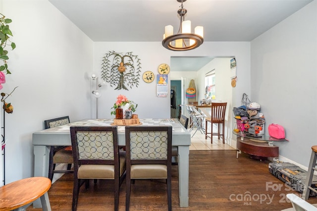 2217 Tate St, Charlotte, NC 28216 - dining room with wood finished floors and a chandelier