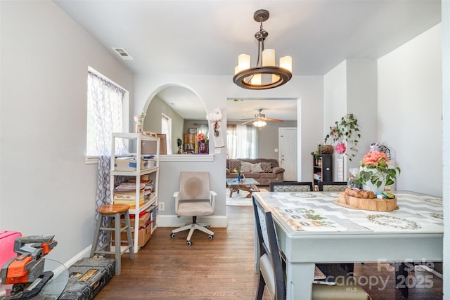 2217 Tate St, Charlotte, NC 28216 - dining room featuring a chandelier, wood finished floors, ceiling fan, and baseboards