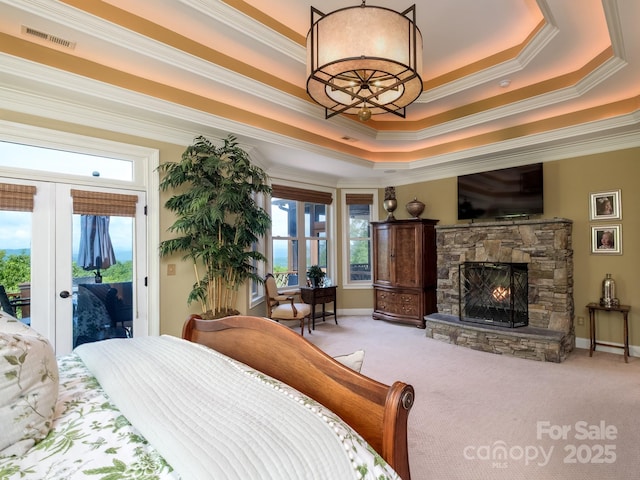 41 Annakesta Ct, Brevard, NC 28712 - carpeted bedroom featuring access to exterior, crown molding, a tray ceiling, a fireplace, and a chandelier