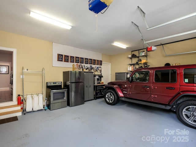 41 Annakesta Ct, Brevard, NC 28712 - garage featuring freestanding refrigerator and a garage door opener