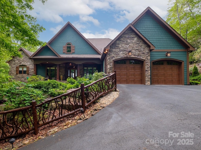 41 Annakesta Ct, Brevard, NC 28712 - craftsman-style house featuring stone siding, driveway, an attached garage, and a porch
