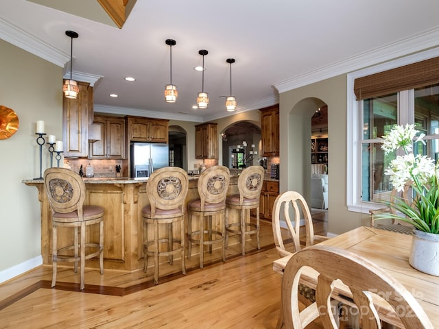 41 Annakesta Ct, Brevard, NC 28712 - kitchen featuring stainless steel fridge, arched walkways, light wood finished floors, backsplash, and recessed lighting