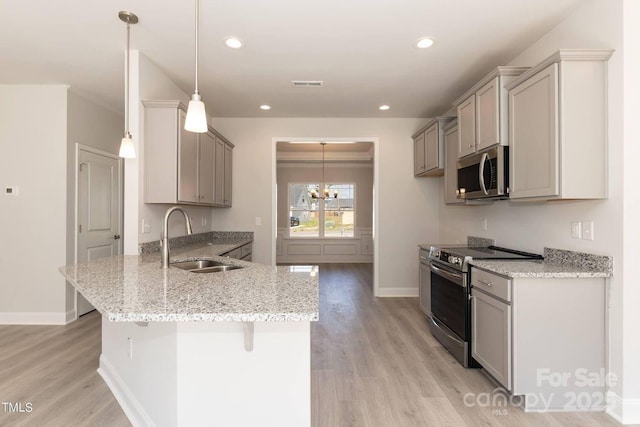 236 Mountain Island Rd Unit 40, Statesville, NC 28677 - kitchen featuring appliances with stainless steel finishes, a sink, a peninsula, light wood-type flooring, and recessed lighting