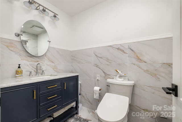 2320 Doster Rd, Monroe, NC 28112 - bathroom with tile walls, vanity, and toilet