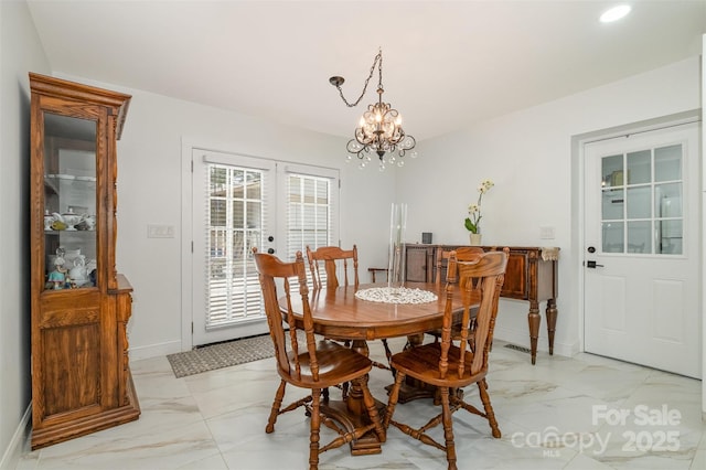 2320 Doster Rd, Monroe, NC 28112 - dining space with light marble finish floors, baseboards, a chandelier, and french doors