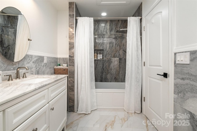 2320 Doster Rd, Monroe, NC 28112 - bathroom featuring marble finish floors, vanity, shower / bathtub combination with curtain, tile walls, and a wainscoted wall