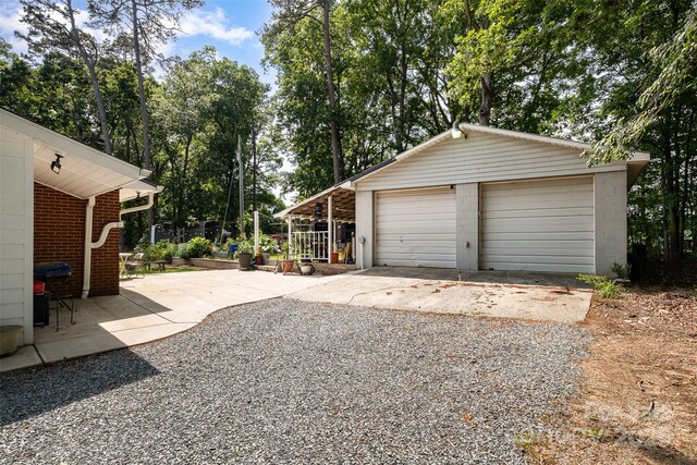 2320 Doster Rd, Monroe, NC 28112 - detached garage featuring view of scattered trees
