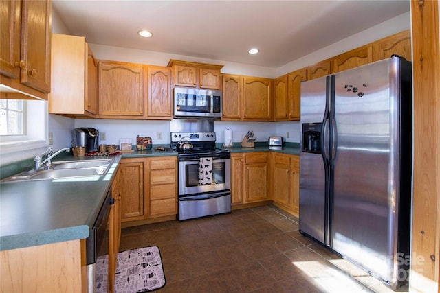 693 Blackberry Ridge Rd, Burnsville, NC 28714 - kitchen featuring stainless steel appliances, a sink, dark countertops, dark tile patterned floors, and recessed lighting
