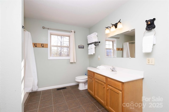 693 Blackberry Ridge Rd, Burnsville, NC 28714 - bathroom featuring vanity, toilet, baseboards, and tile patterned flooring